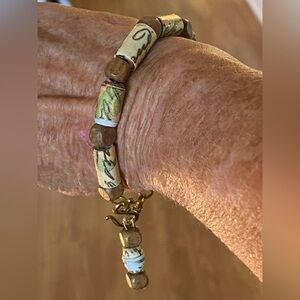 Beads handmade from paper and coated with lacquer to protect beads